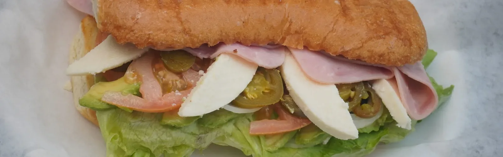 Mexican sandwich with ham, avocado, lettuce and tomato at Erica's World's Best Mexican Desserts